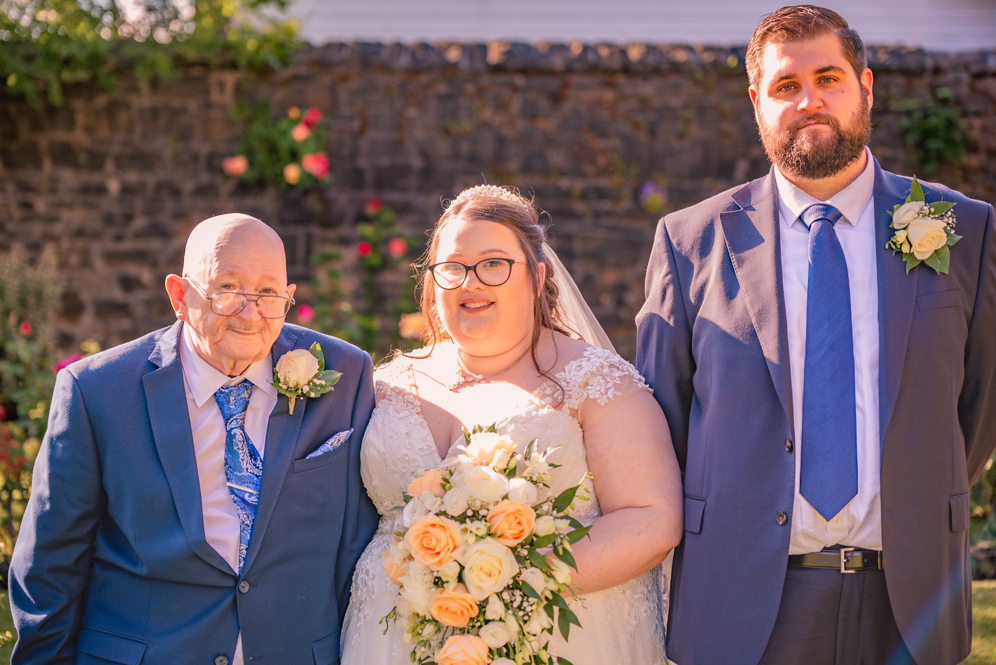Bride and groom with father of the bride