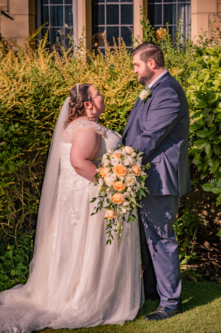 Bride and groom facing each other