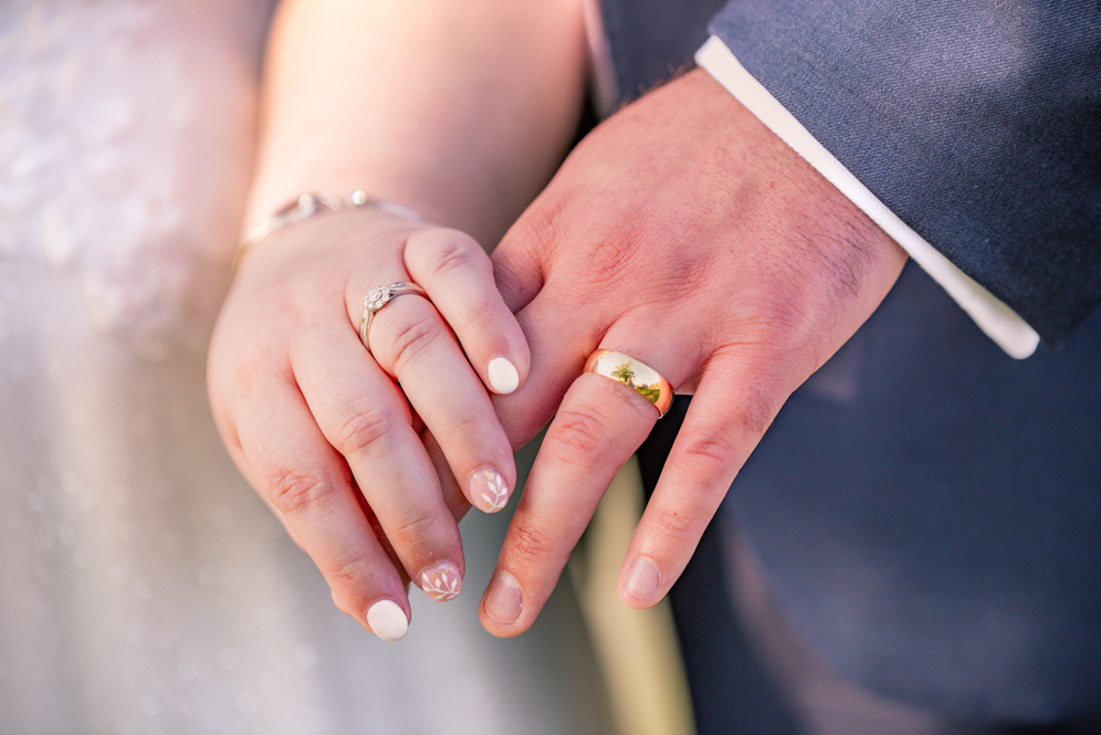 Close-up of the bride and groom rings