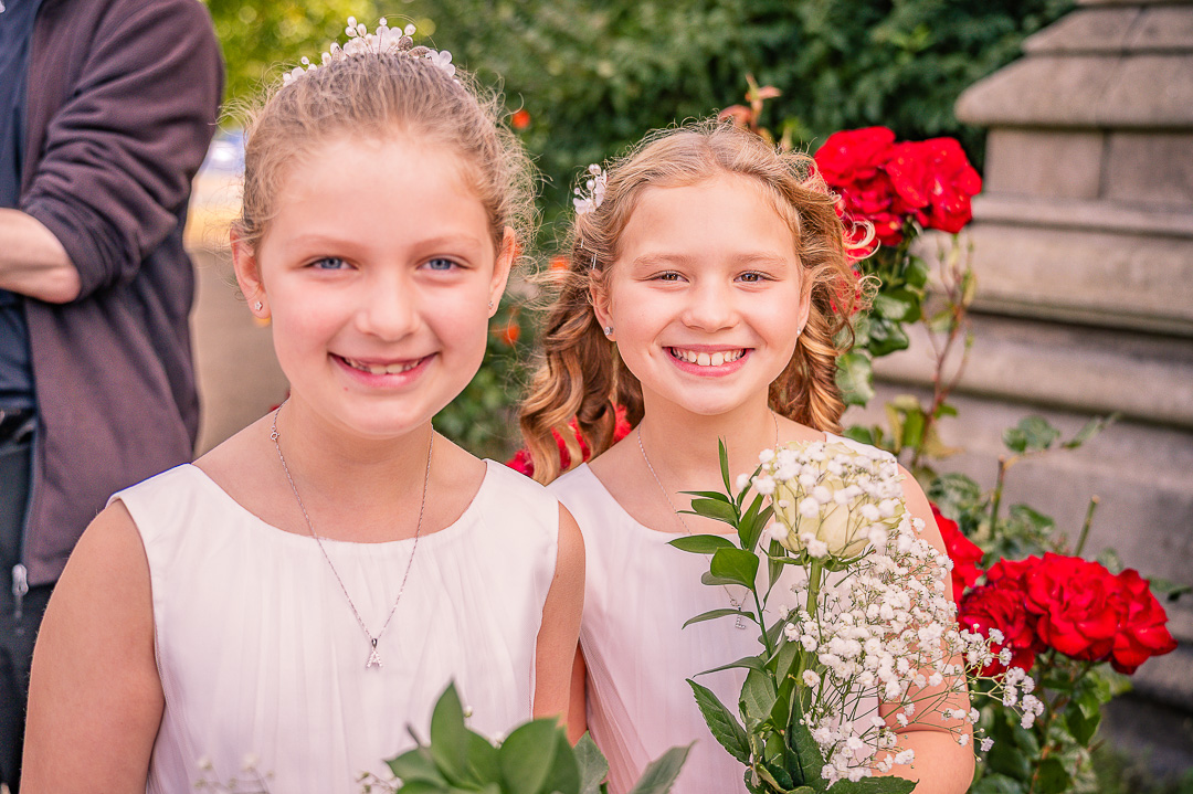 Two flower girls smiling