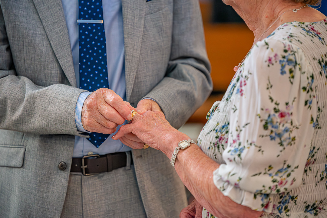 Close-up of rings being exchanged during the vow renewal