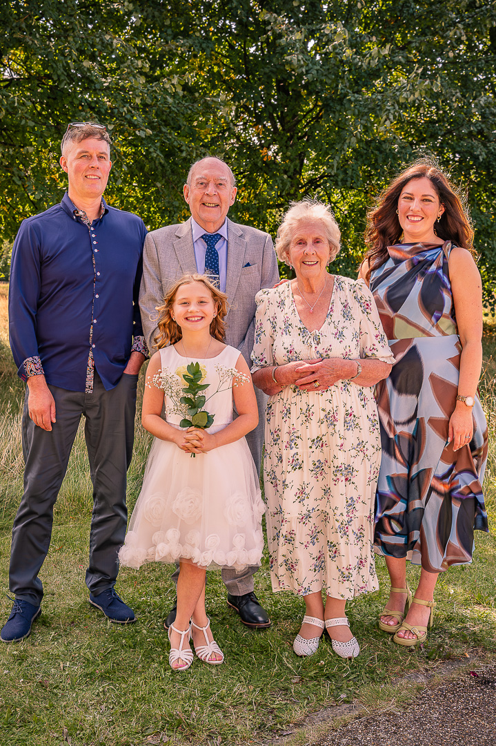 Older couple with grandchildren at St Peter’s Church, Ashton-under-Lyne, traditional Christian wedding vow renewal