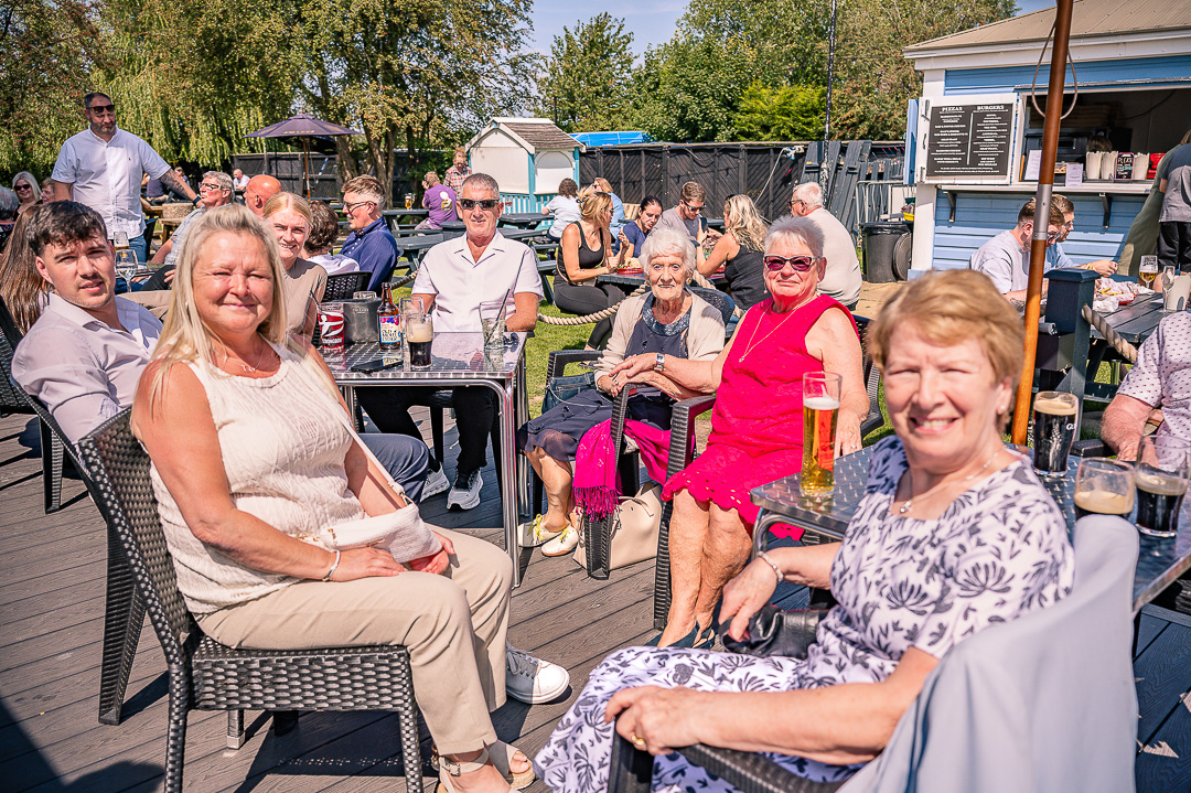 Guests enjoying drinks outside during the reception.