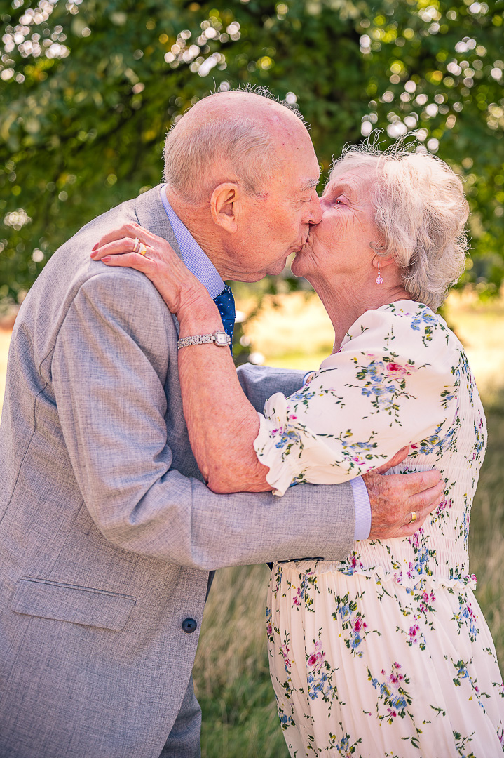 Dennis and Patricia kissing at St Peter’s Church, Ashton-under-Lyne, traditional Christian wedding vow renewal