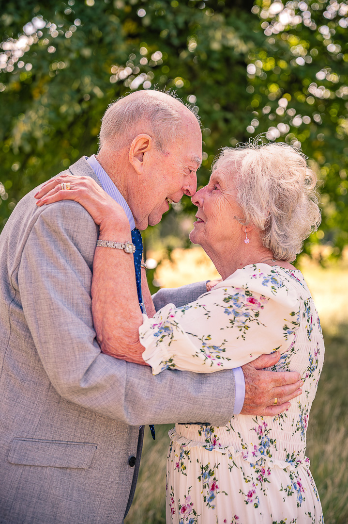 Dennis and Patricia sharing a close moment at St Peter’s Church, Ashton-under-Lyne, traditional Christian wedding vow renewal
