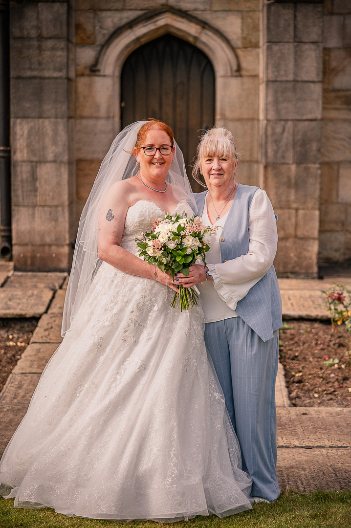 Portrait of the bride with her mother outside the church following the ceremony