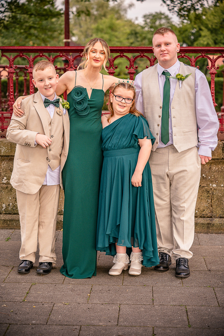 Two young best men with a bridesmaid and junior bridesmaid during portraits at Broadfield Park
