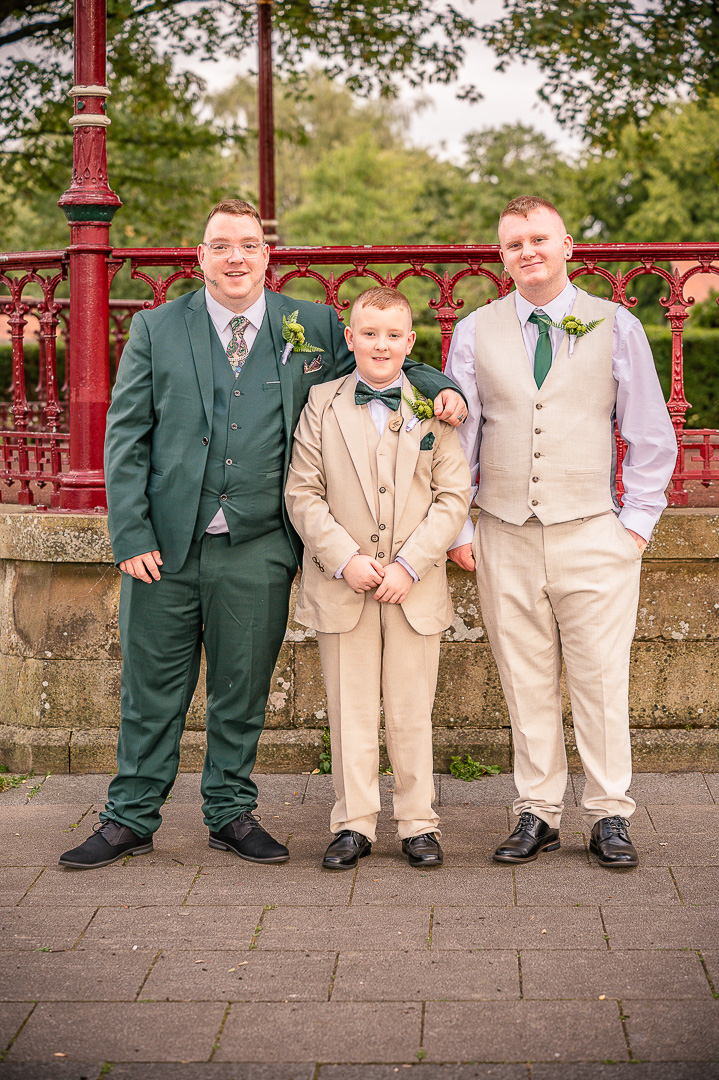 Groom with his two sons, the best men, in front of the bandstand at Broadfield Park
