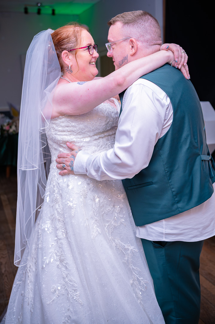Bride and groom sharing their first dance at Bucks Bar during a traditional, Christian wedding celebration