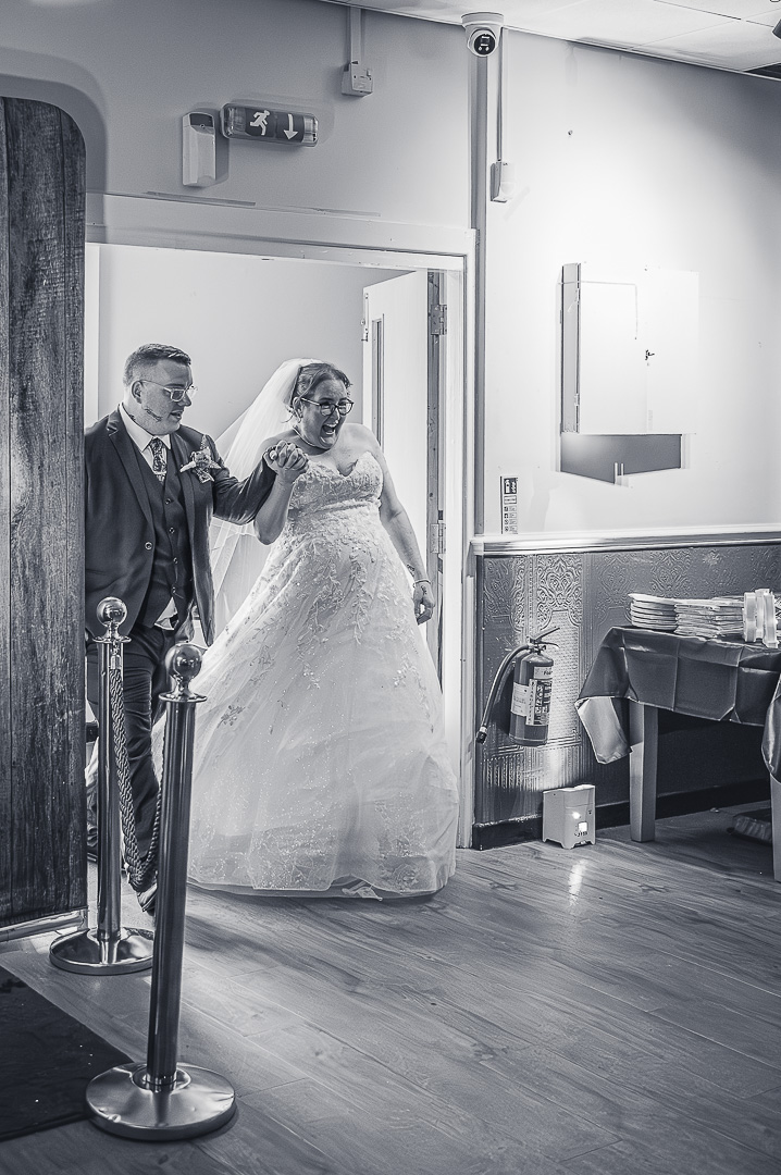 Bride and groom arriving at Bucks Bar in Rochdale for their elegant, traditional wedding reception