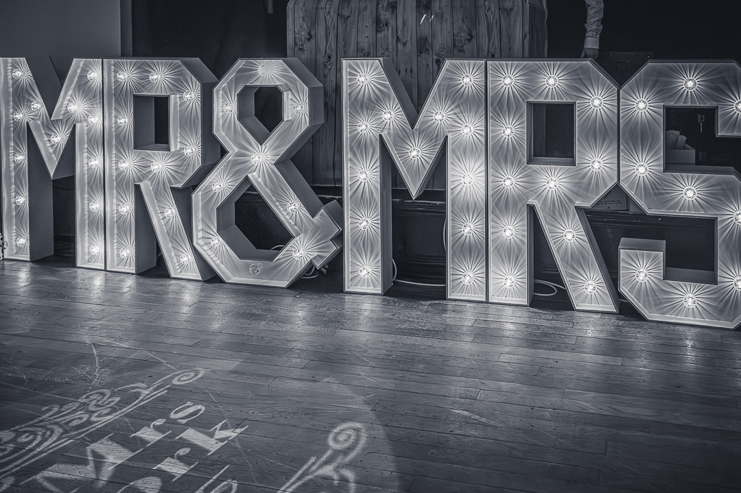 Illuminated “Mr & Mrs” sign at Bucks Bar for a traditional and joyful wedding celebration