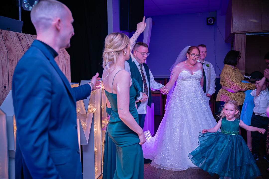 Bride dancing with guests on the dance floor at Bucks Bar during a traditional, elegant wedding