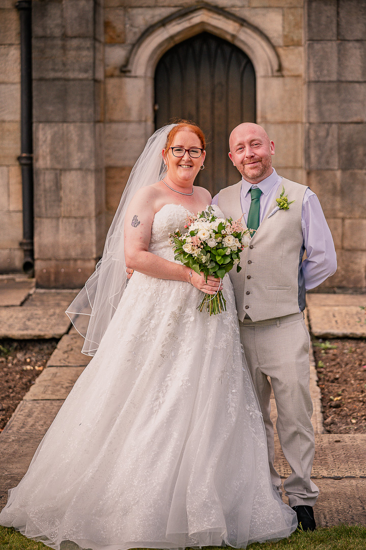 Bride with her brother outside St Chad’s Church after the ceremony