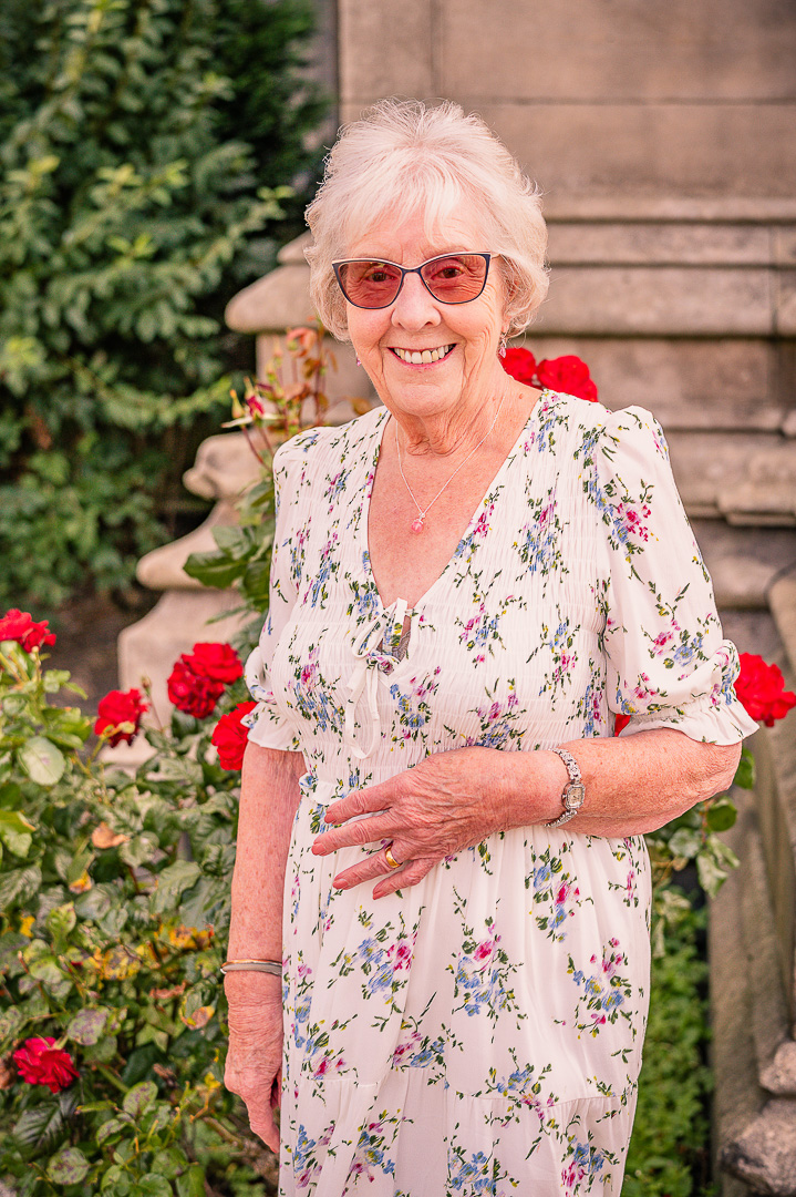 Patricia smiling outside St Peter’s Church before renewing her vows