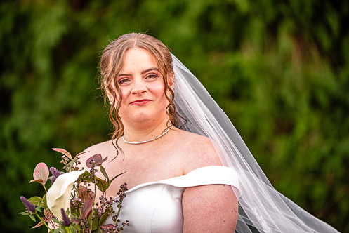Bride and groom sitting on a bench