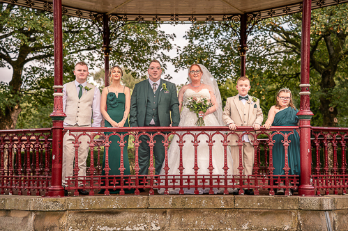 Bride and groom sitting on a bench