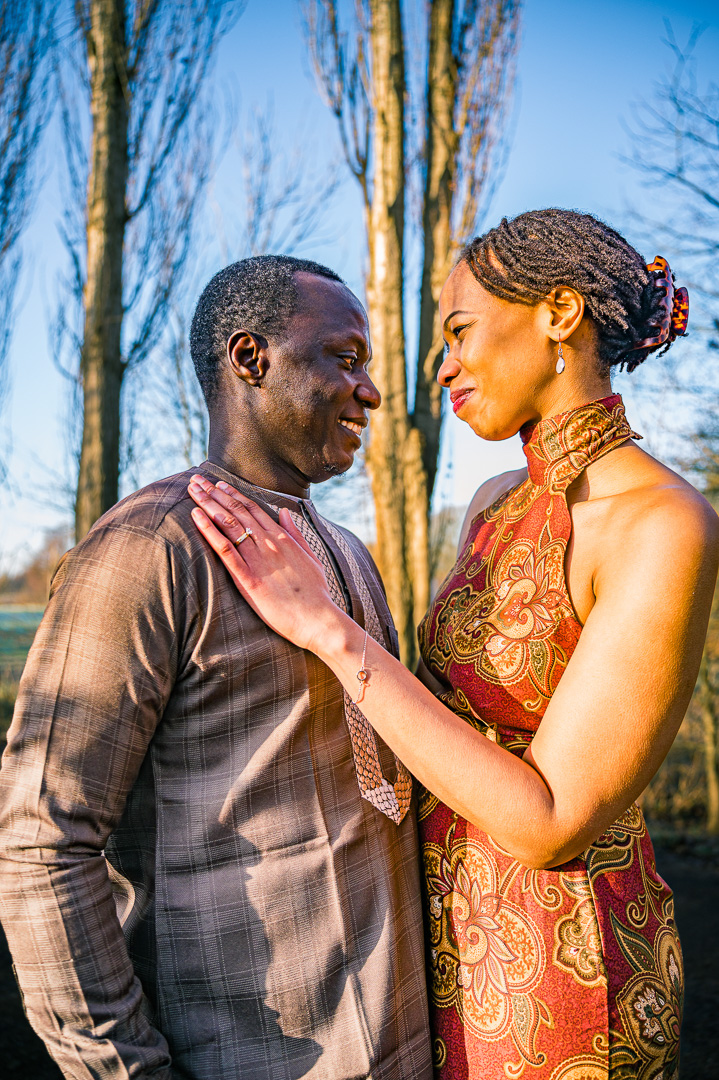 Bea and Abraham embracing during engagement portraits at Fletcher Moss Gardens.