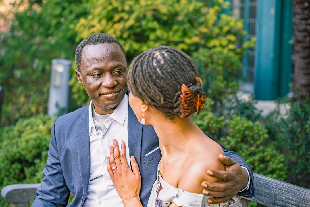 Engagement portrait of Bea and Abraham surrounded by greenery in Parsonage Gardens.