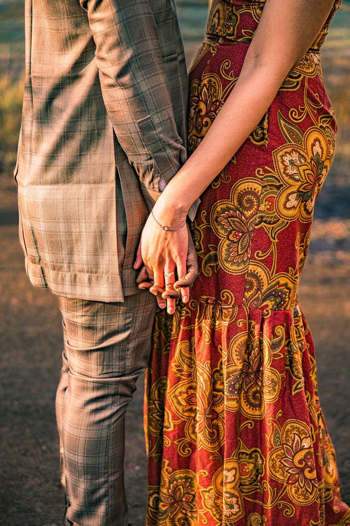 Bea and Abraham holding hands during engagement portraits at Fletcher Moss Manchester.