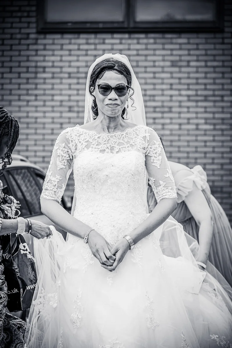 Bride taking a moment before her wedding blessing in Manchester