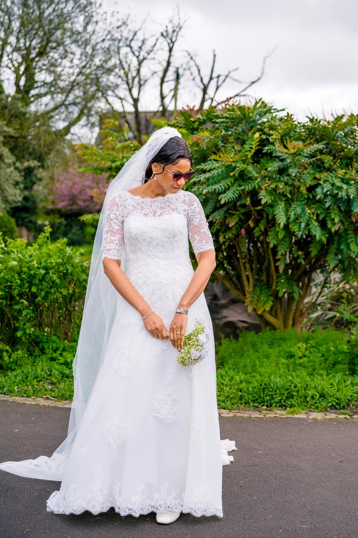 Bride portrait at Alexandra Park during wedding blessing celebrations in Manchester