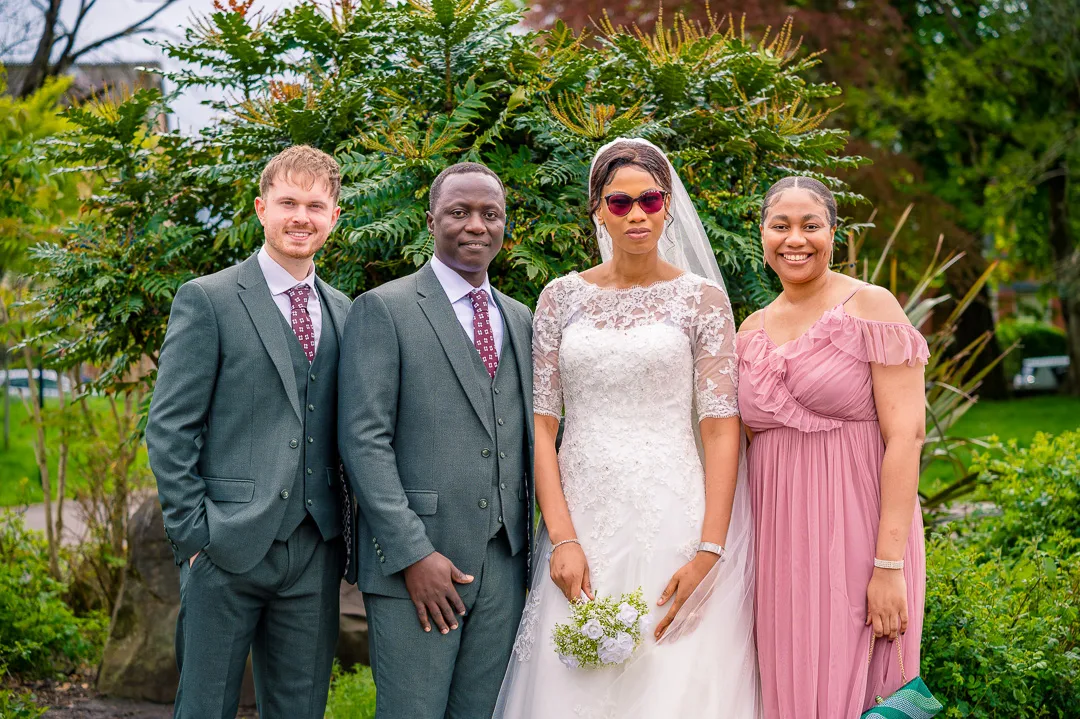 bride and groom portrait with Bestman and Bridesmaid at Alexandra Park, Manchester, during Bea and Abraham's wedding blessing celebrations