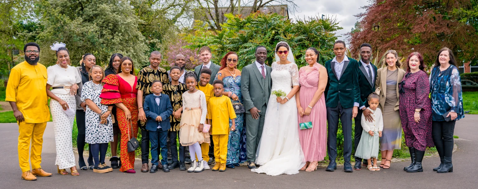 Portrait of Bride and groom their close friends and family at Alexandra Park, Manchester, during Bea and Abraham's wedding blessing celebrations