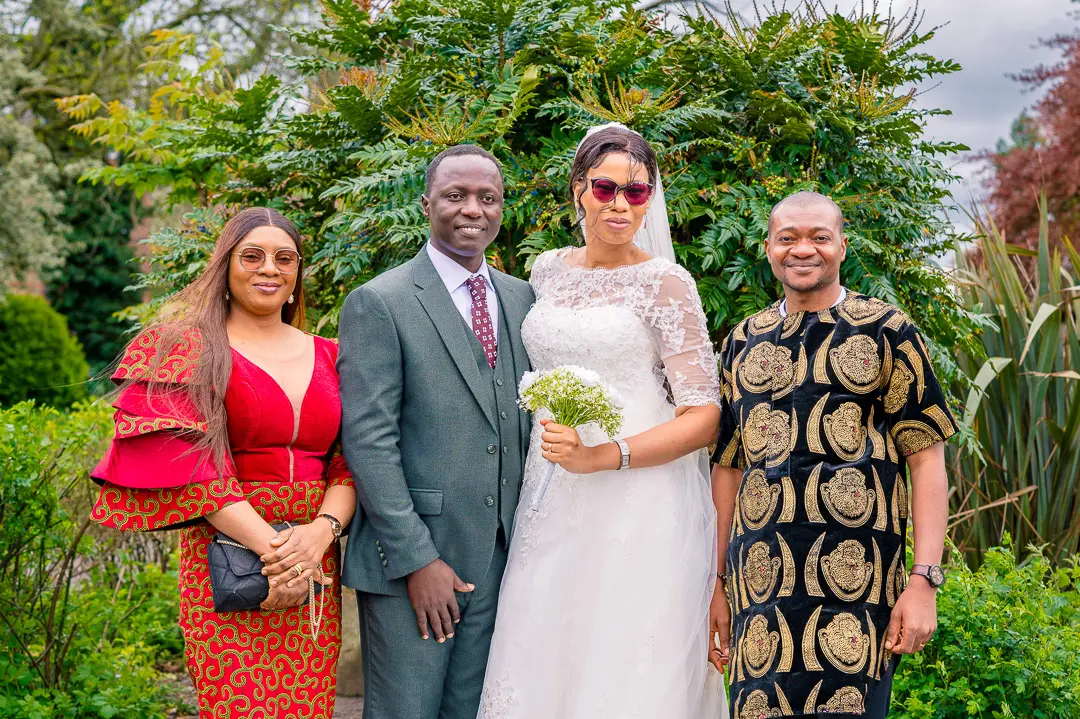 Portrait of Bride and groom with couple at Alexandra Park, Manchester, during Bea and Abraham's wedding blessing celebrations