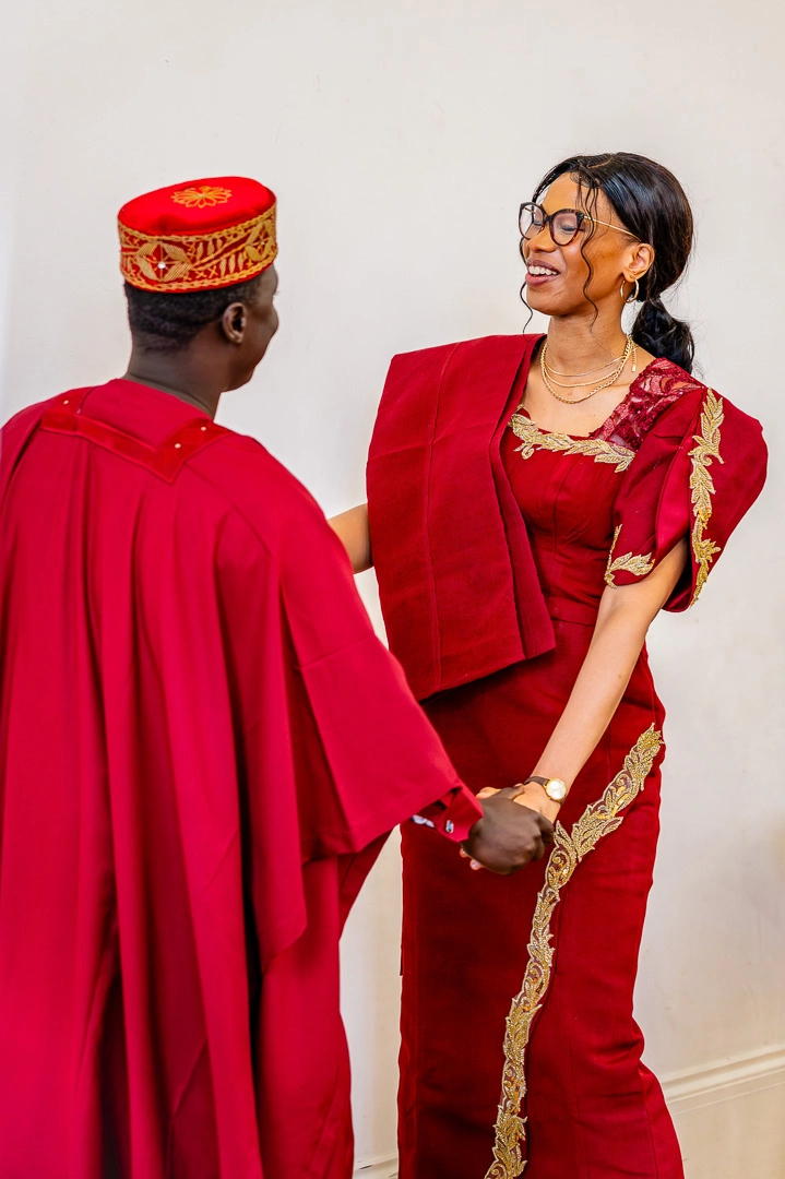 Bea and Abraham dancing in their traditional African wedding outfits at the reception at 422 Community Hub, Manchester