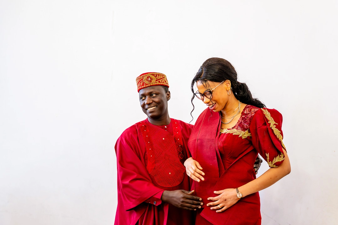 Bea and Abraham in their traditional African wedding outfits at the reception in Ardwick, Manchester