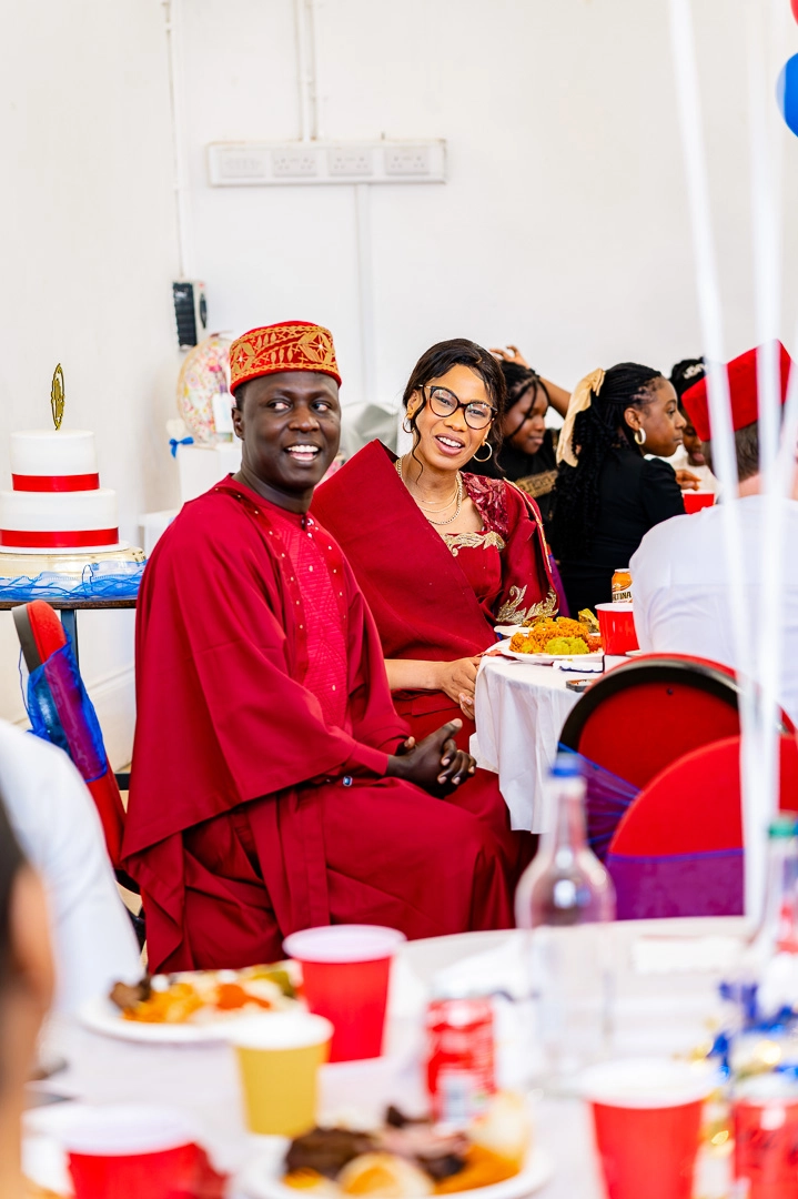 Bea and Abraham enjoying their reception in their traditional African wedding outfits at the reception at 422 Community Hub, Ardwick, Manchester