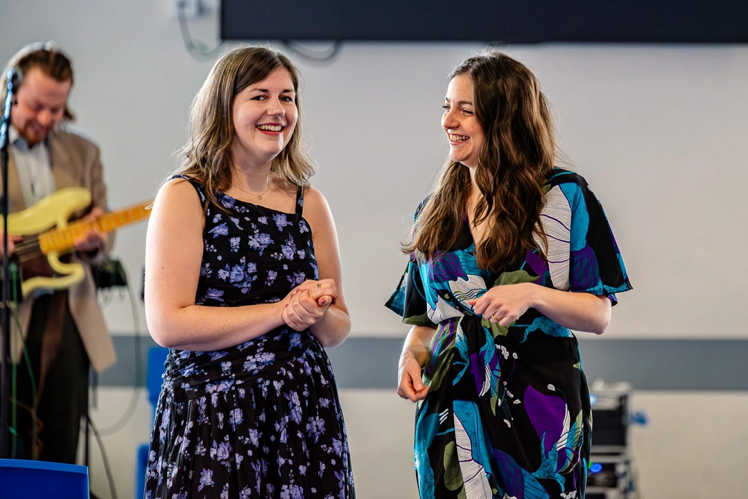 Wedding guests laughing at William Hulme's Grammar School, Manchester
