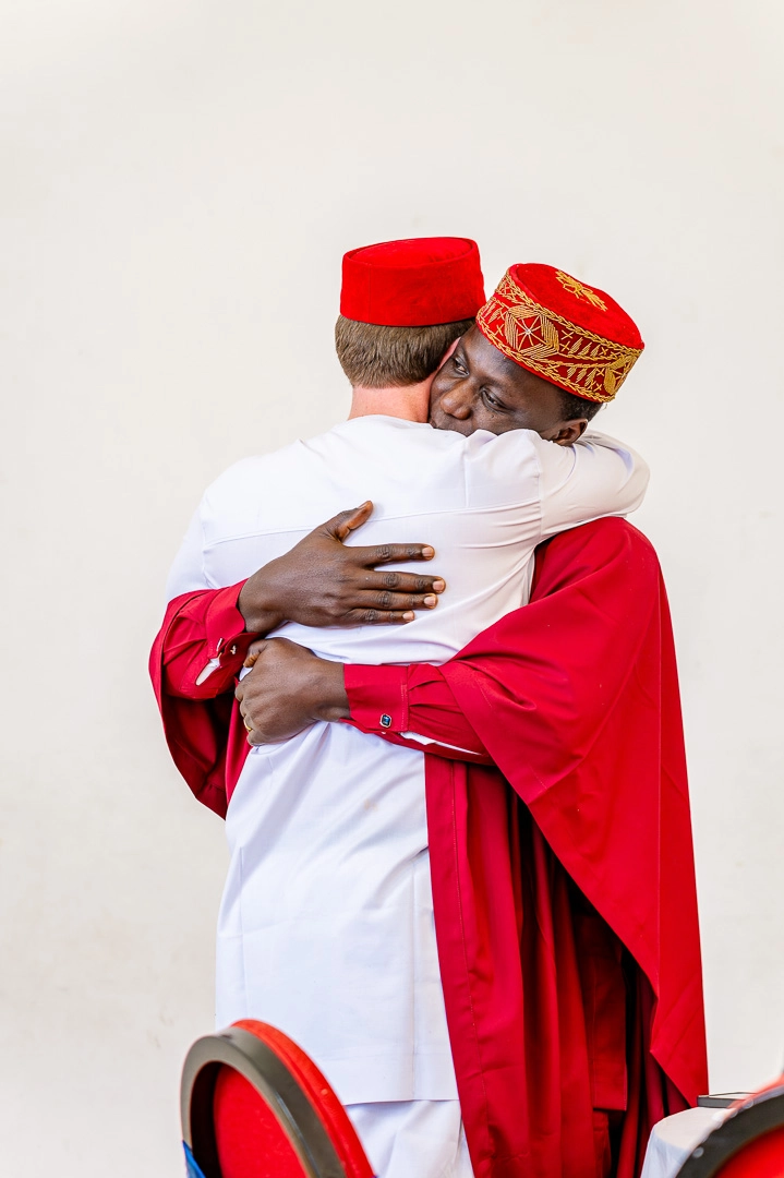 Groom and Best man hugging follow his speech 422 Community Hub, Ardwick, Manchester, during Bea and Abraham's wedding reception